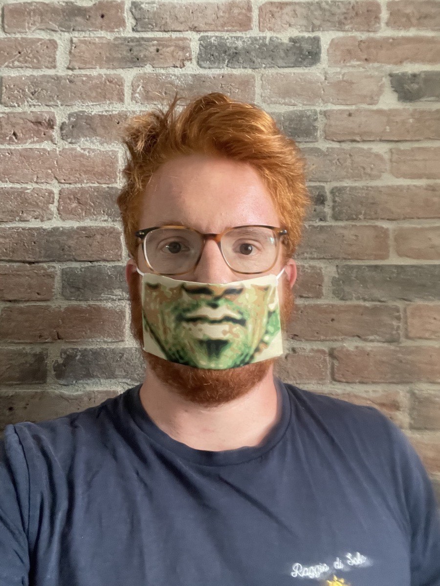 Yann wears a mask printed with an adversarial camouflage pattern.